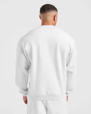 Cozy up in the Academy Oversized Sweater Grey Marl, featuring a relaxed fit and soft fabric for effortless everyday style.